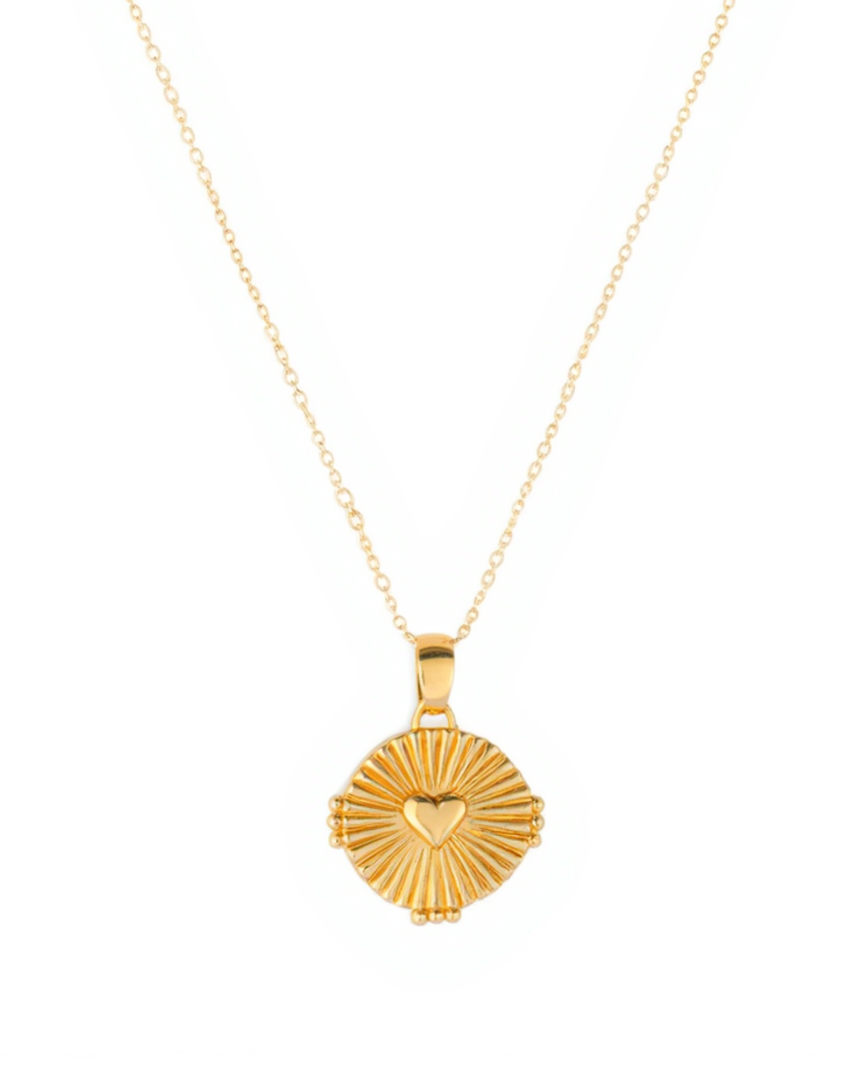 Gold necklace with a heart-shaped pendant on a white background